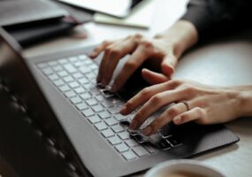 Close up of woman working on computer