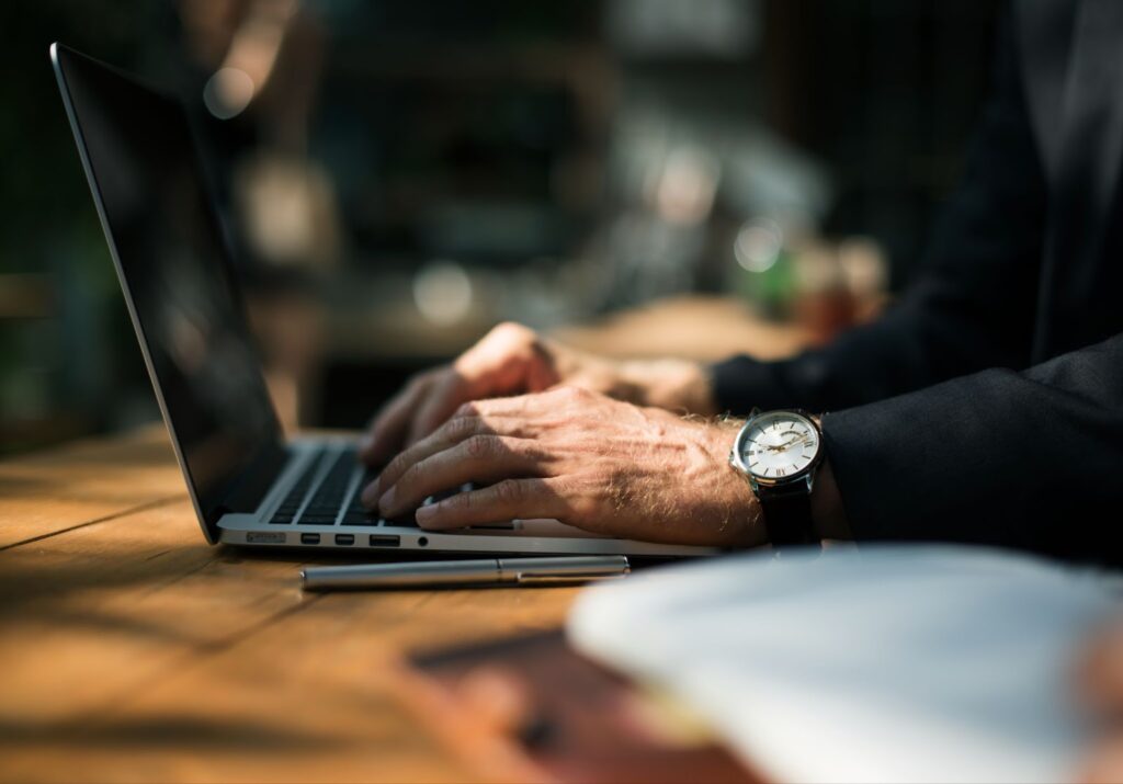 Close up of man working with laptop